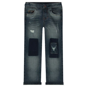 Jeans effet used et crinkle avec ombres et déchirures 