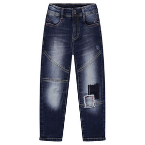 Jeans effet used fourche basse avec patchs et découpes 