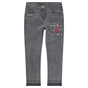 Jeans effet used et crinkle avec fantaisies sur les jambes 