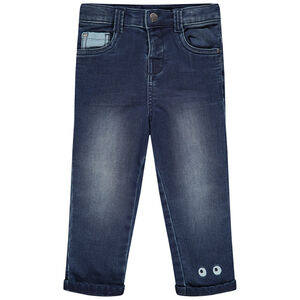 Jean effet used doublé jersey à yeux brodés 