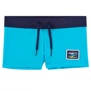 Boxer de bain bleu avec badge 