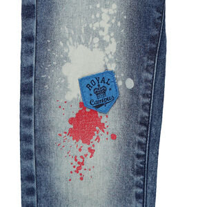 Jeans effet used avec badges et taches de peinture printées 