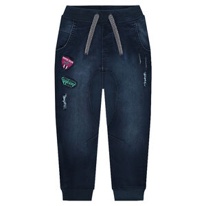 Jeans en molleton effet denim used avec badges 