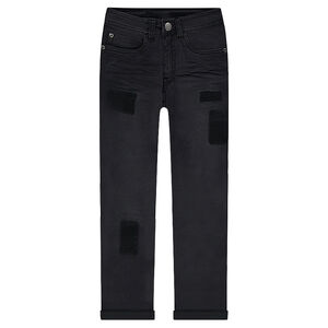 Jeans effet used et crinkle avec ombres de patchs 