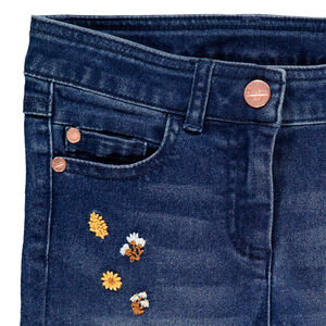 Jean slim effet used à broderies florales 