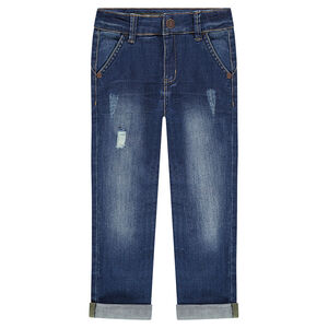 Jeans effet used avec textes printés au dos 