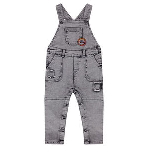 Salopette en jeans effet dévalé et used avec patch forme écusson 
