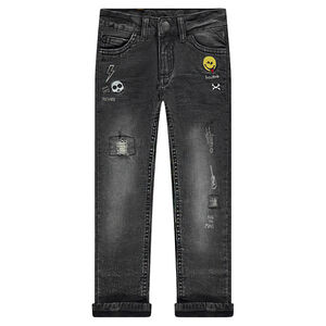 Jeans effet used doublé jersey avec badges brodés 