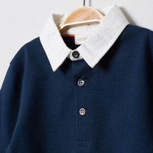 Polo manches longues en coton bio à bandes contrastées 