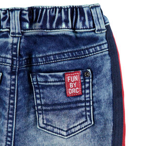 Jeans effet used élastiqué avec bandes contrastées sur les cotés 