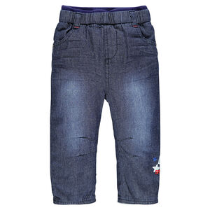 Jeans effet used doublé jersey avec print fantaisie 