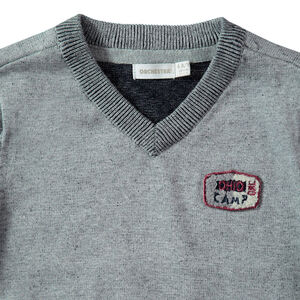 Pull en tricot chiné avec badge sur la poitrine 