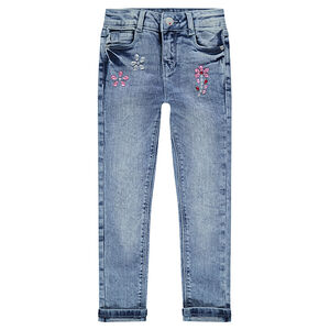 Jeans effet used avec strass fantaisie coupe slim 