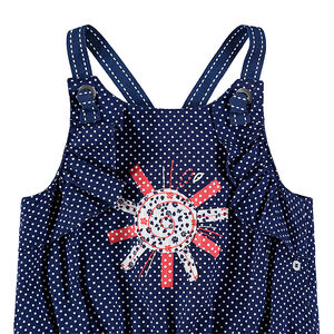 Combinaison courte à pois avec soleil brodé 