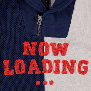 Pull en tricot bicolore avec col zippé et inscription en bouclette 