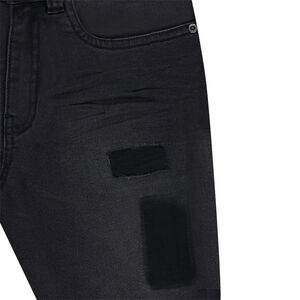 Jeans effet used et crinkle avec ombres de patchs 