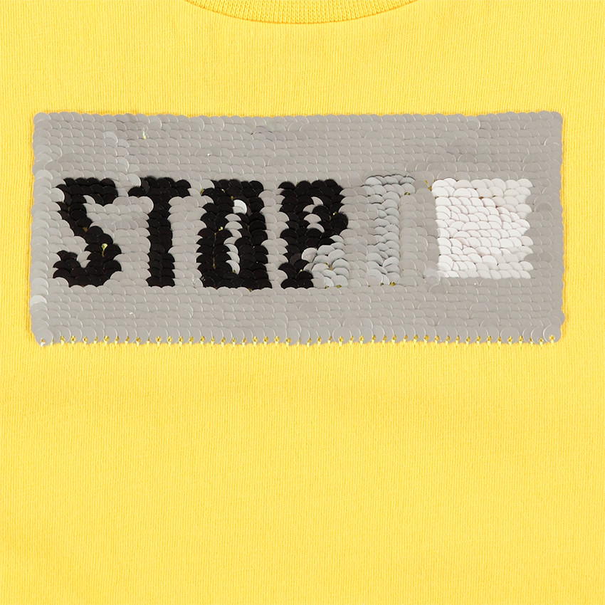 Tee-shirt manches courtes en jersey jaune avec message en sequins magiques 