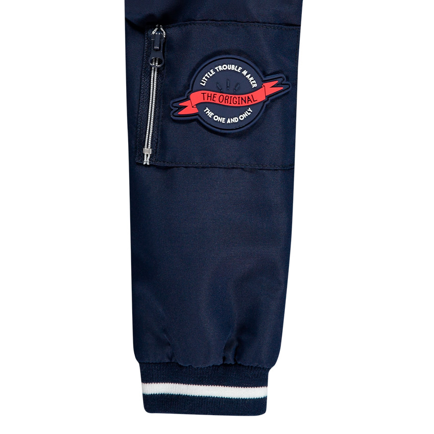 Coupe-vent uni avec doublure en jersey rayé et poches 