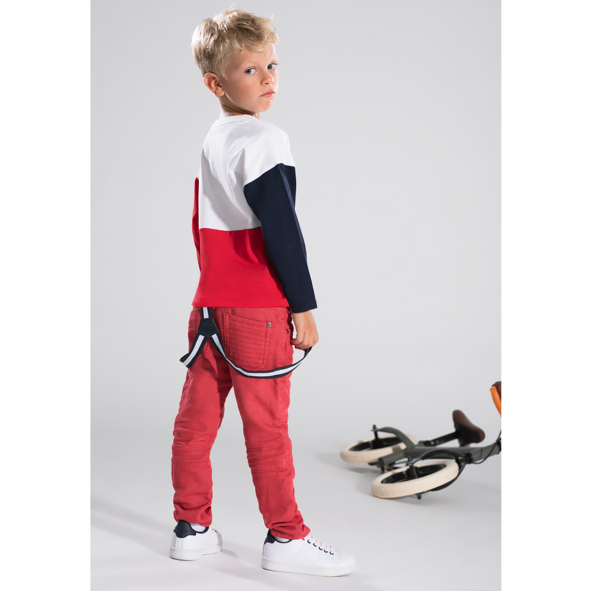 Pantalon en toile rouge effet used avec bretelles amovibles élastiquées 