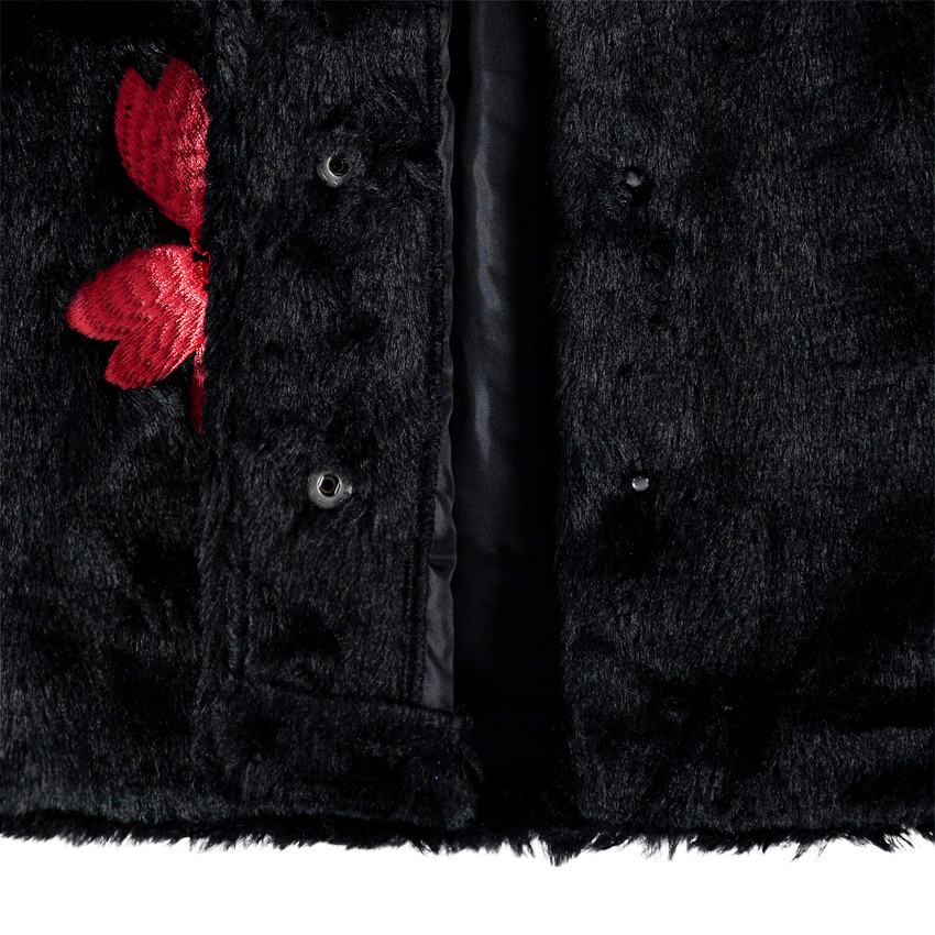 Gilet sans manches en fausse fourrure avec fleur bordée 