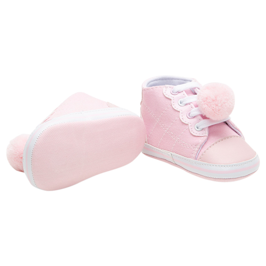 Baskets souples en toile à lacets et pompon 