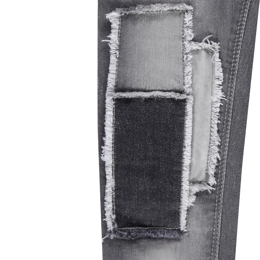 Jeans slim à patchs et franges effet used 