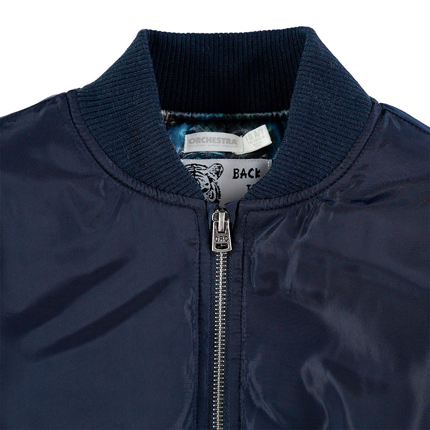 Junior - Teddy bleu uni avec doublure imprimée et poche zippée 