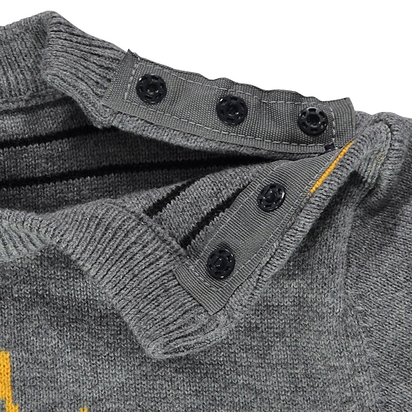 Pull en tricot réversible avec 1 côté uni motif jacquard et 1 côté rayé 