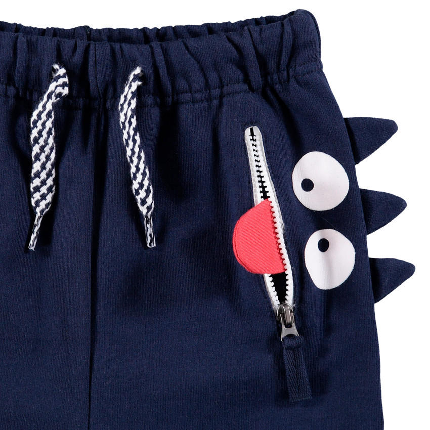 Pantalon de jogging en molleton avec poche zippée et monstre printé 