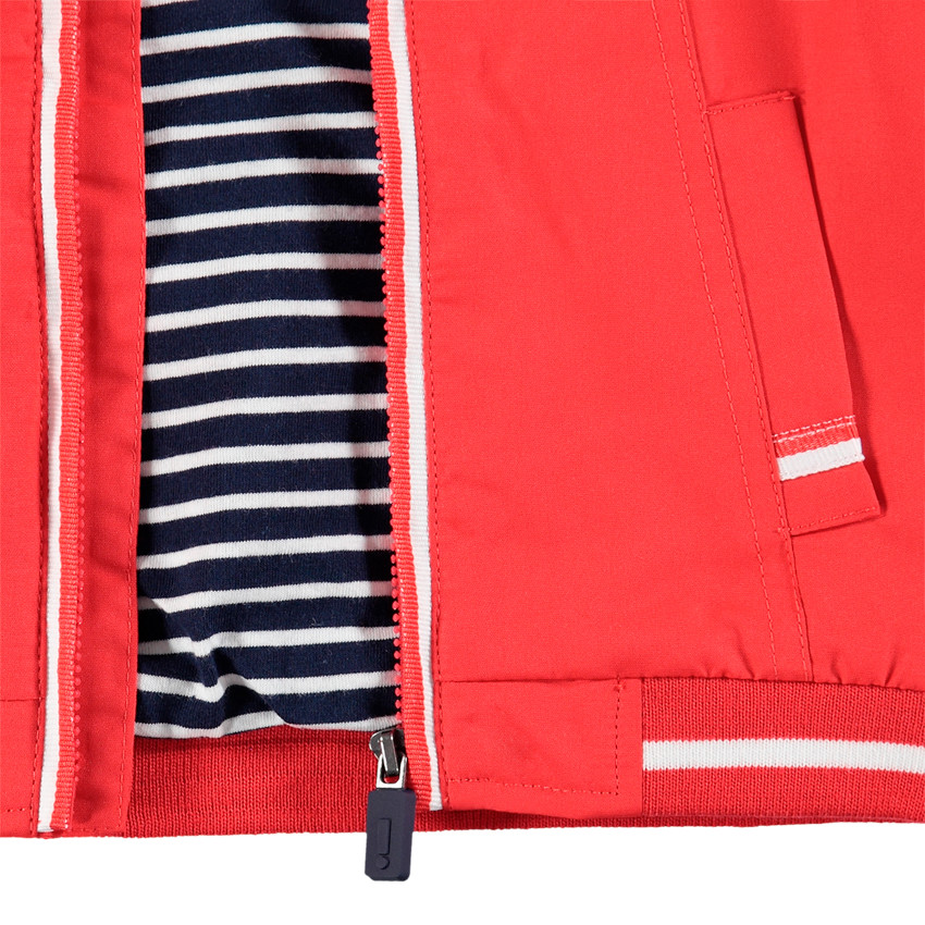 Coupe-vent uni avec doublure en jersey rayé et poches 