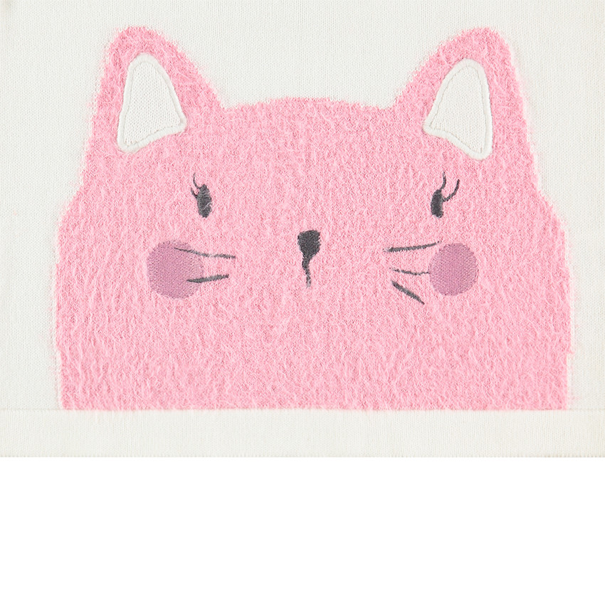 Pull en tricot avec emmanchures volantées et boutonnage dos 