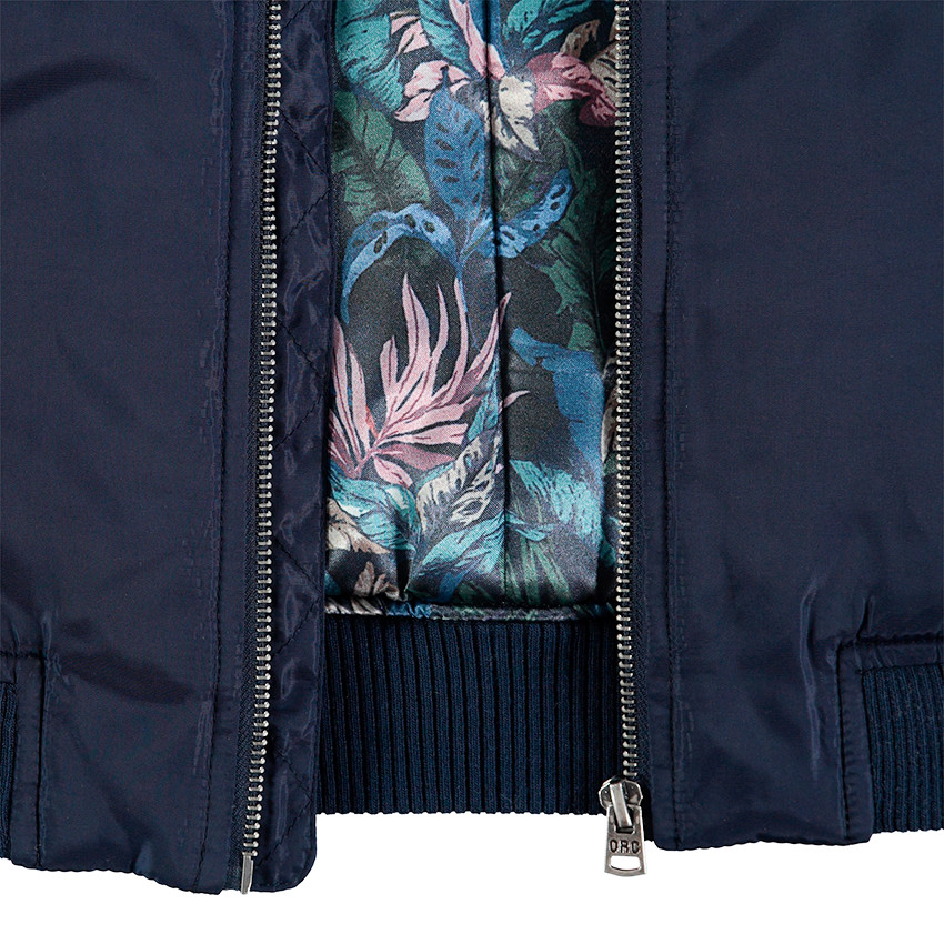 Junior - Teddy bleu uni avec doublure imprimée et poche zippée 