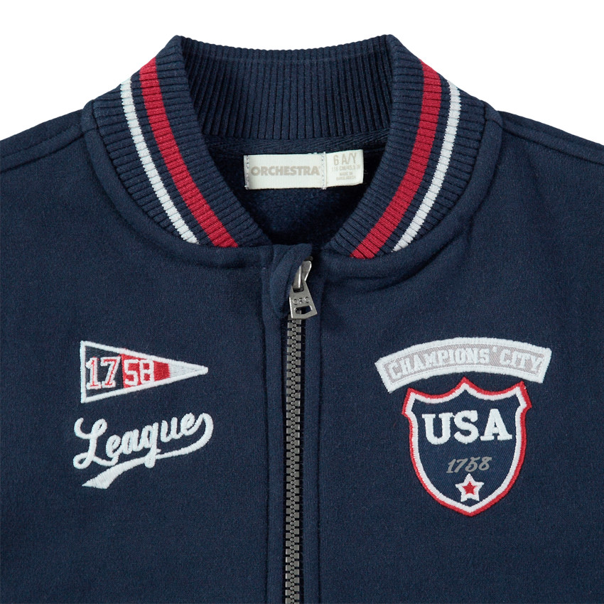 Teddy en molleton bicolore avec badges et broderies 