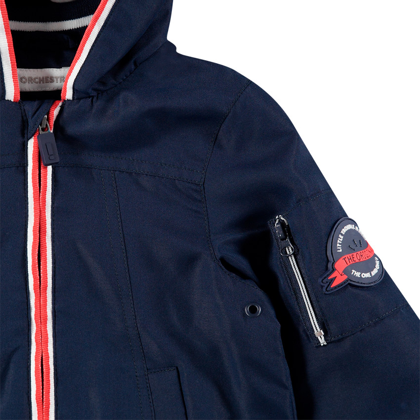 Coupe-vent uni avec doublure en jersey rayé et poches 