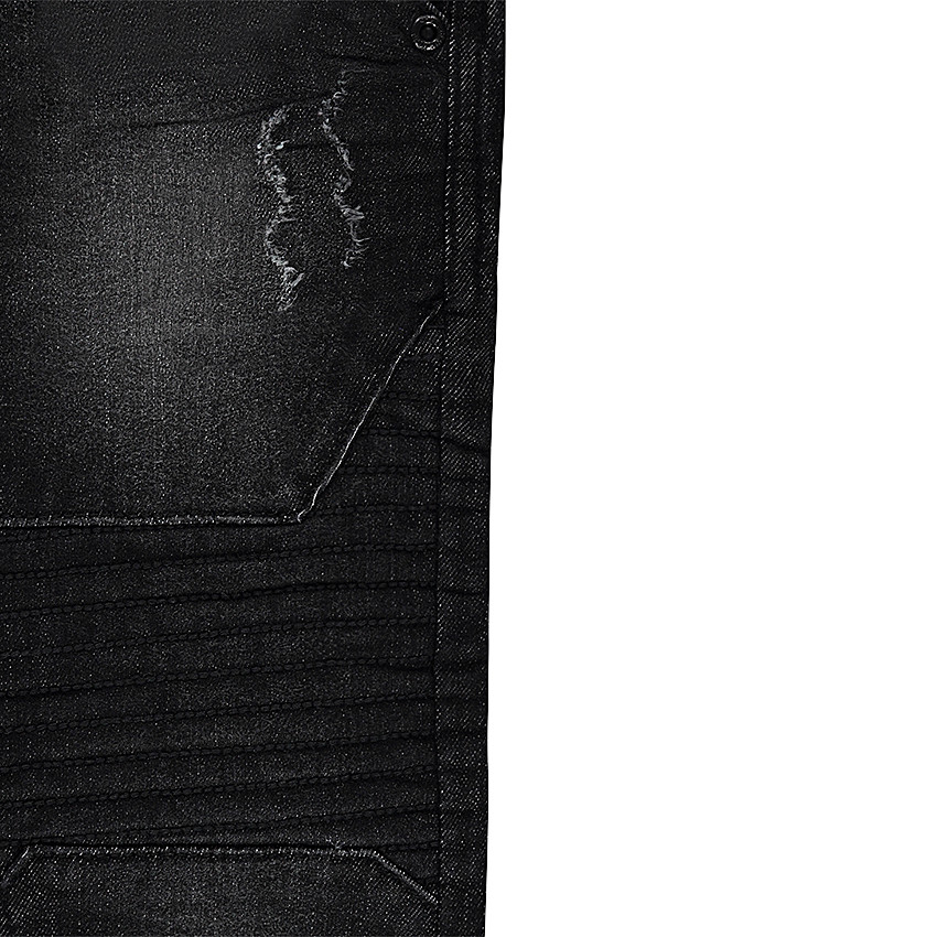 Jeans effet used et crinkle avec découpes  