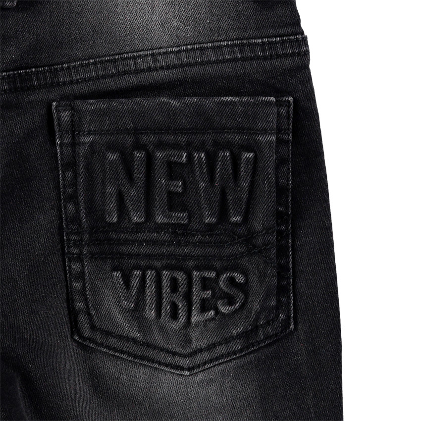 Junior - Jeans effet used et crinkle avec inscription en relief au dos 