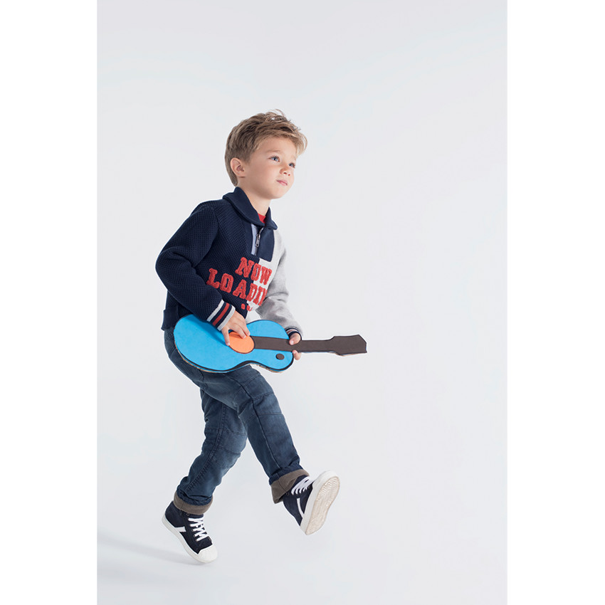 Pull en tricot bicolore avec col zippé et inscription en bouclette 