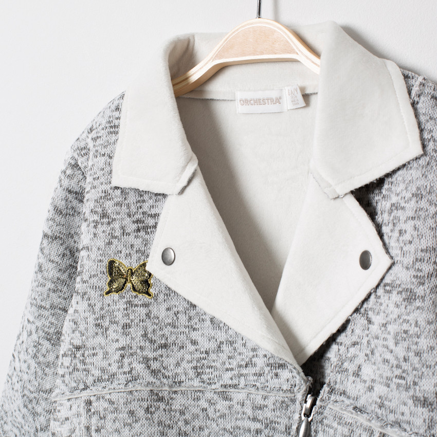 Perfecto en maille twistée à poches zippées et papillon  