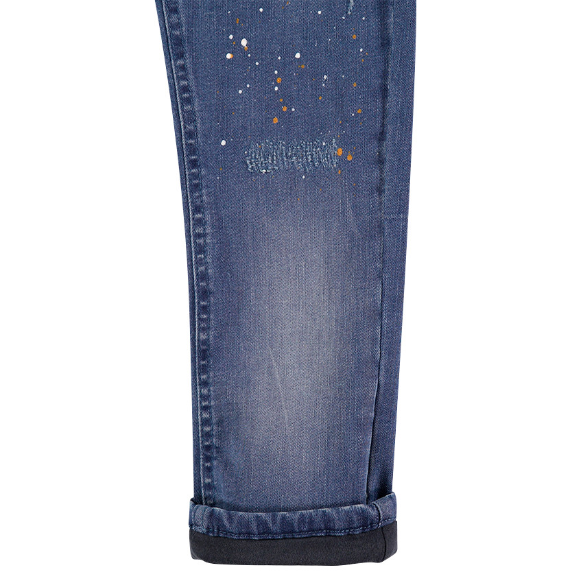 Jeans effet used doublé jersey avec effet de taches de peinture 