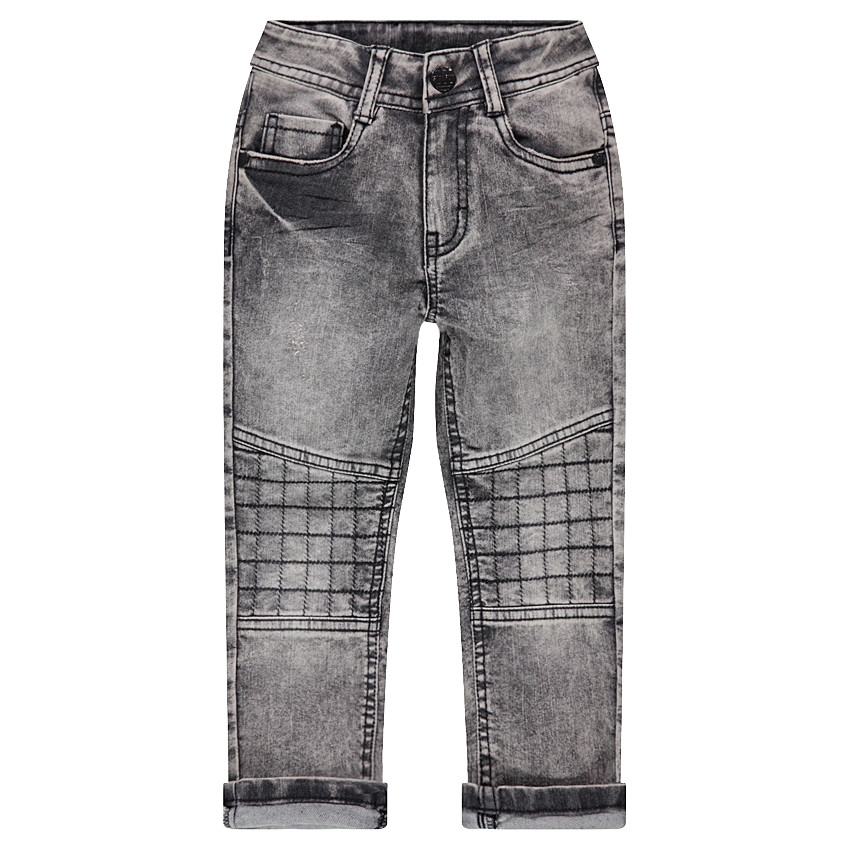 Jeans effet used avec jeux de surpiqûres et découpes 