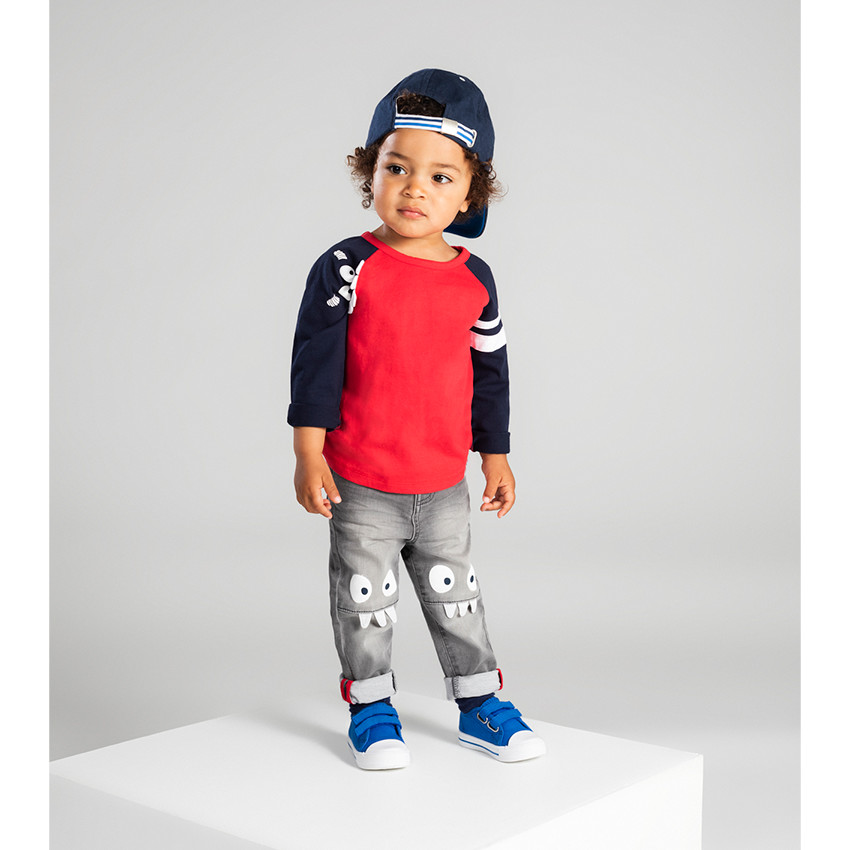 Jean gris effet used et crinkle avec monstres printés sur les genoux 