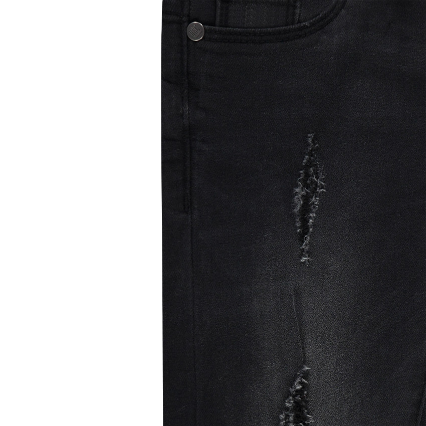 Jeans effet used et crinkle avec déchirures fantaisie 