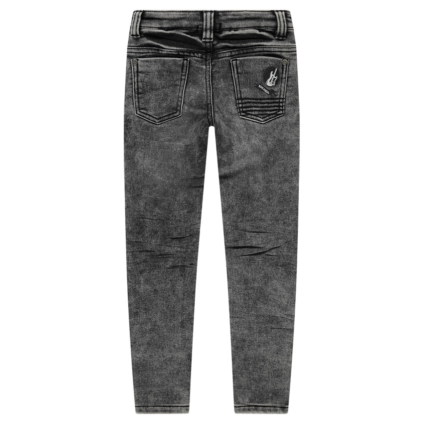 Jeans en denim like effet used avec badge guitare 