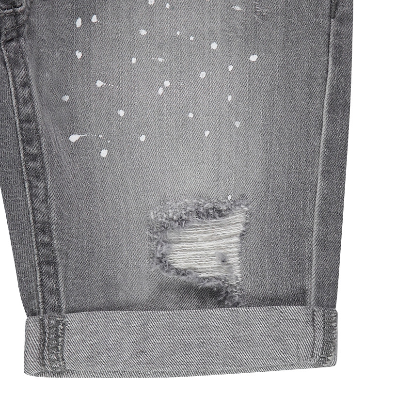 Junior - Bermuda en jeans effet used avec effet de taches de peinture et usures 