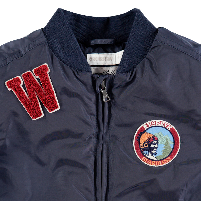 Blouson style bomber à badges et lettre en bouclette 