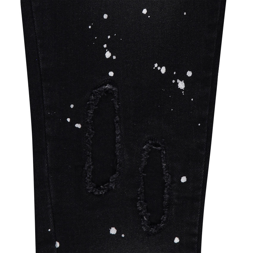 Jeans used avec effet taches de peinture 