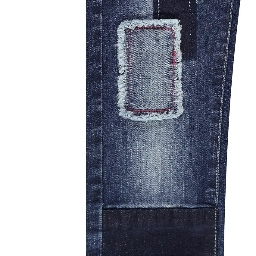 Salopette en jeans effet used avec patchs sur les jambes 