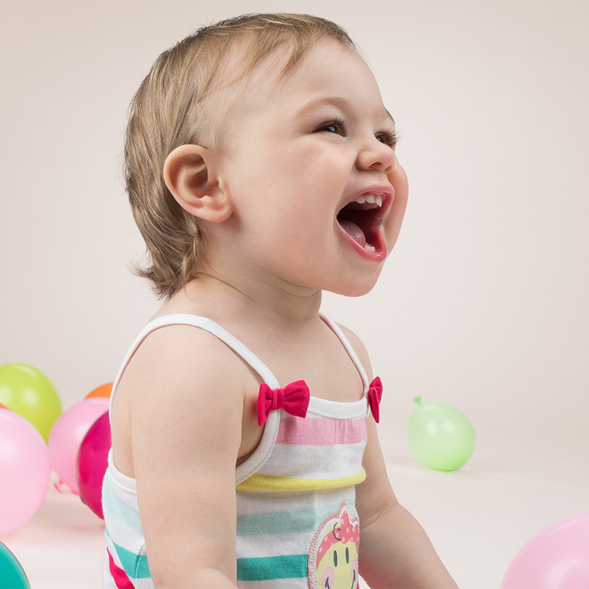 Combinaison courte rayée all-over avec badge Smiley et noeuds 