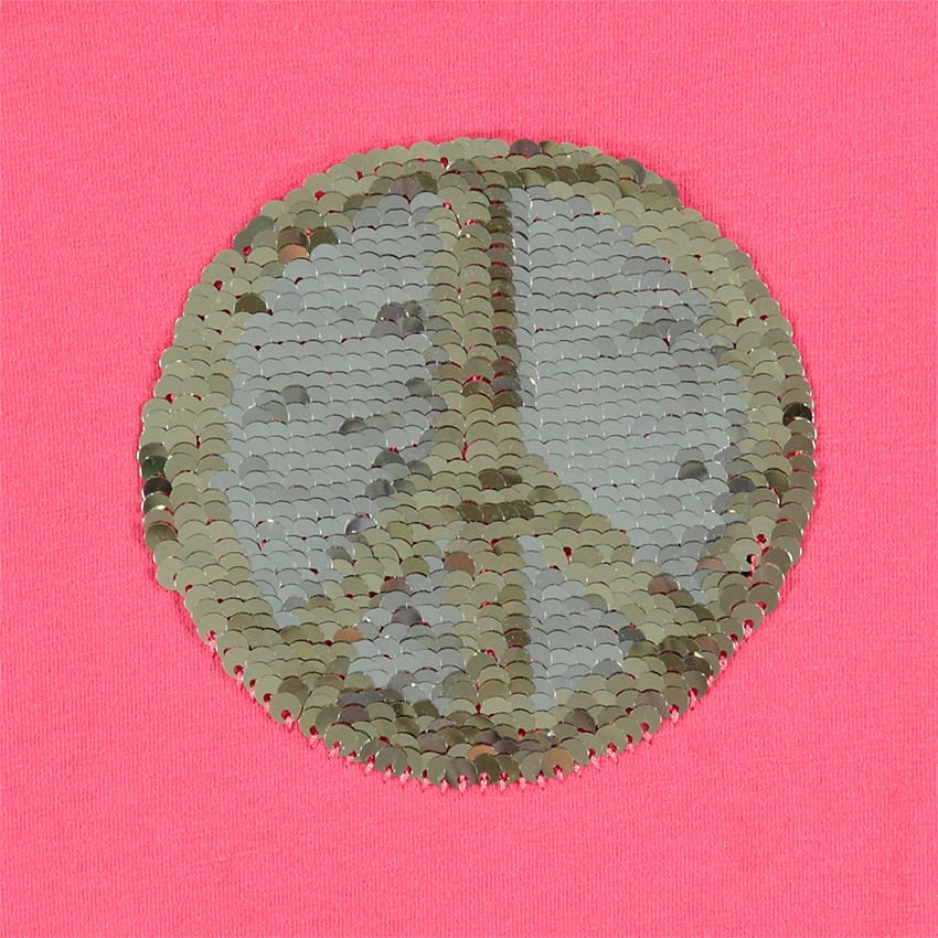 Tee-shirt manches longues en jersey avec message printé et motif en sequins magiques 