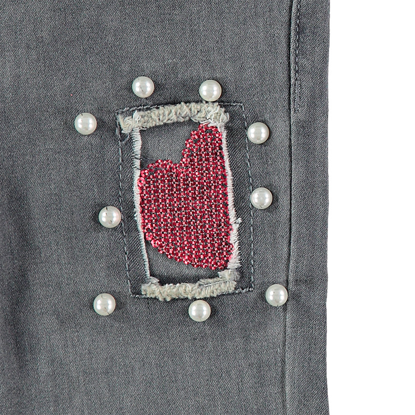 Jeans effet used et crinkle avec fantaisies sur les jambes 